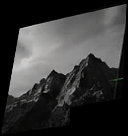 A mountain peak under heavy cloud.