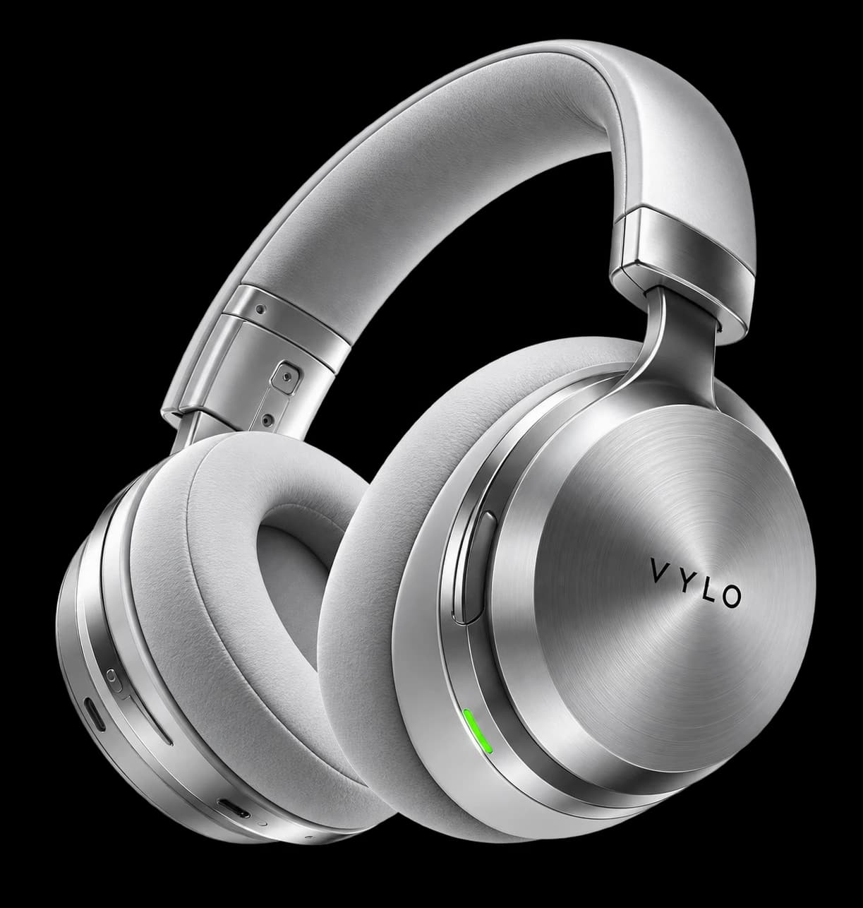 Brushed-silver VYLO headphones with grey cushions and a green light on the ear cup, in front of the words “Make it matter”.