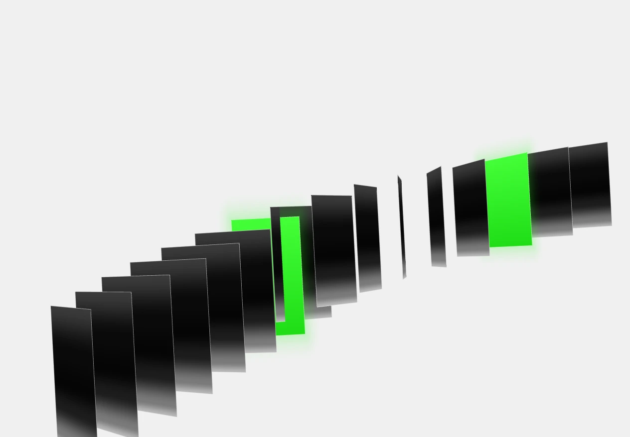 A row of black glass panels turning one after another, two of them bright green.