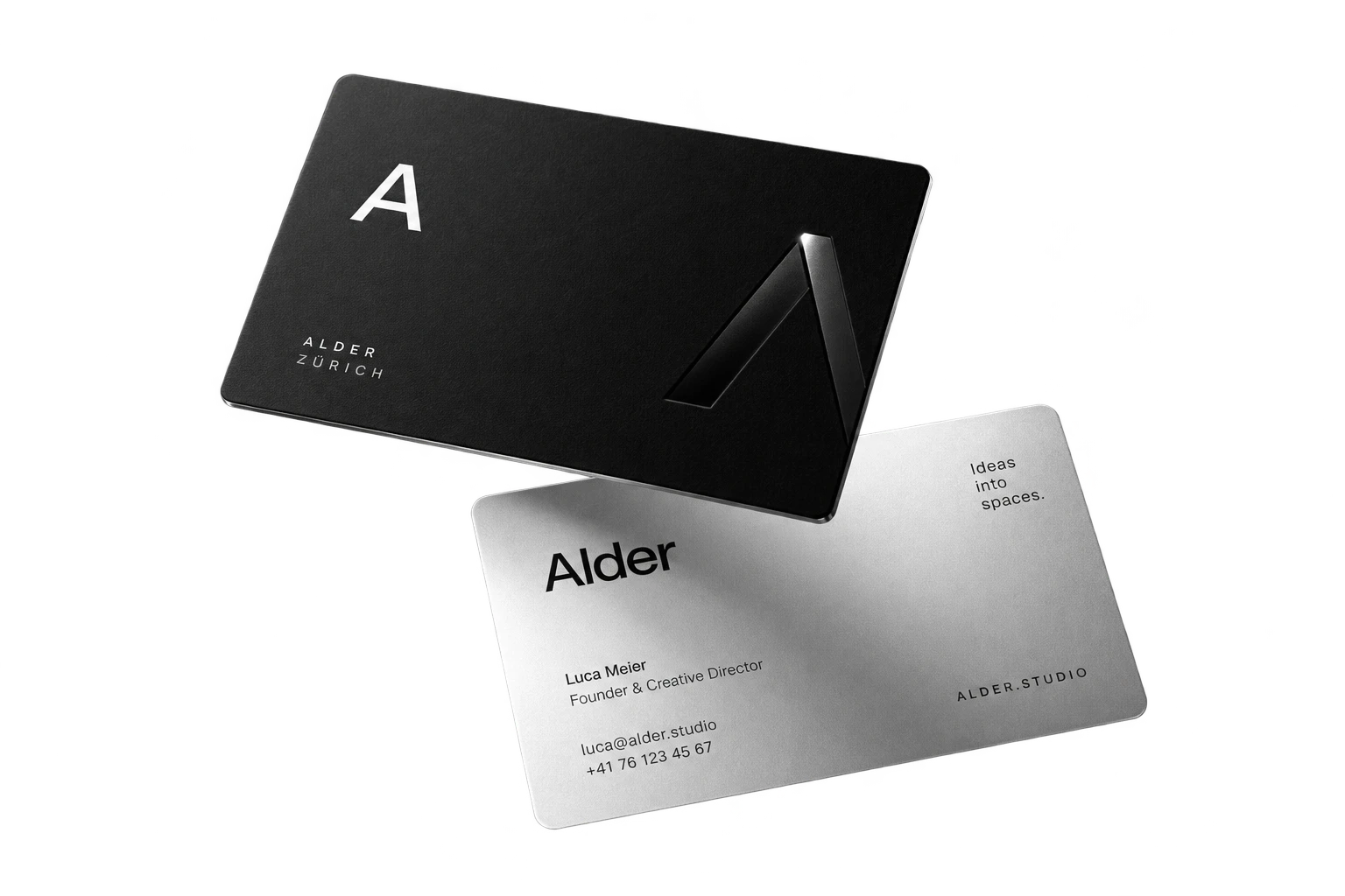 Two Alder business cards in the air: a black one with the letter A, and a silver one with a name, a title and contact details.