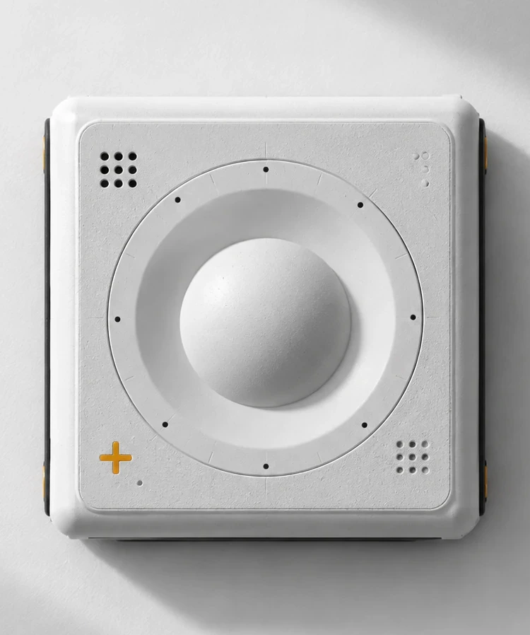 A single square white module with a domed centre, shot from above on a pale ground