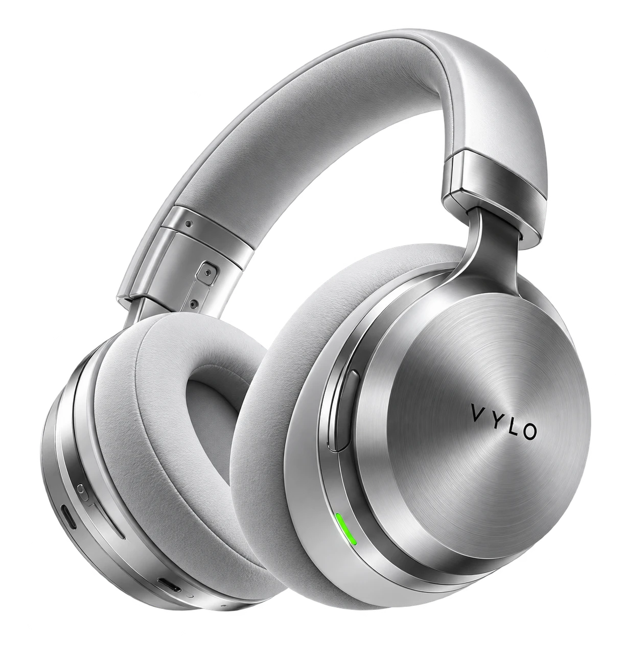 A pair of brushed-metal headphones turning in the dark, one edge lit.